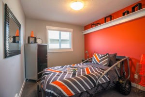 Orange boys bedroom by Edmonton home builder City Homes