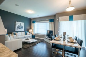 Blue dining and living room by Edmonton home builder City Homes